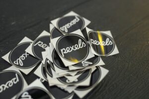 Graphic designer working on logo and website branding on a laptop