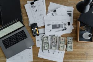 Small business owner planning website cost and budget on laptop