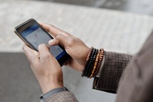 Person searching for local business on Google Maps on smartphone