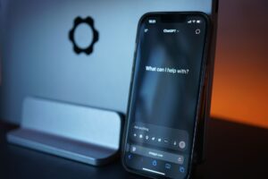Small business owner using ChatGPT AI tools on laptop to save time
