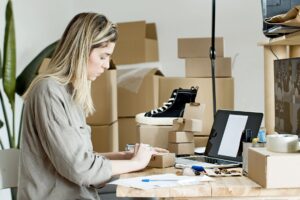 Small business owner reviewing their ecommerce website design on laptop