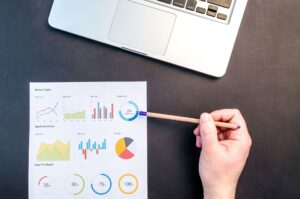 Small business owner reviewing website traffic growth on analytics dashboard