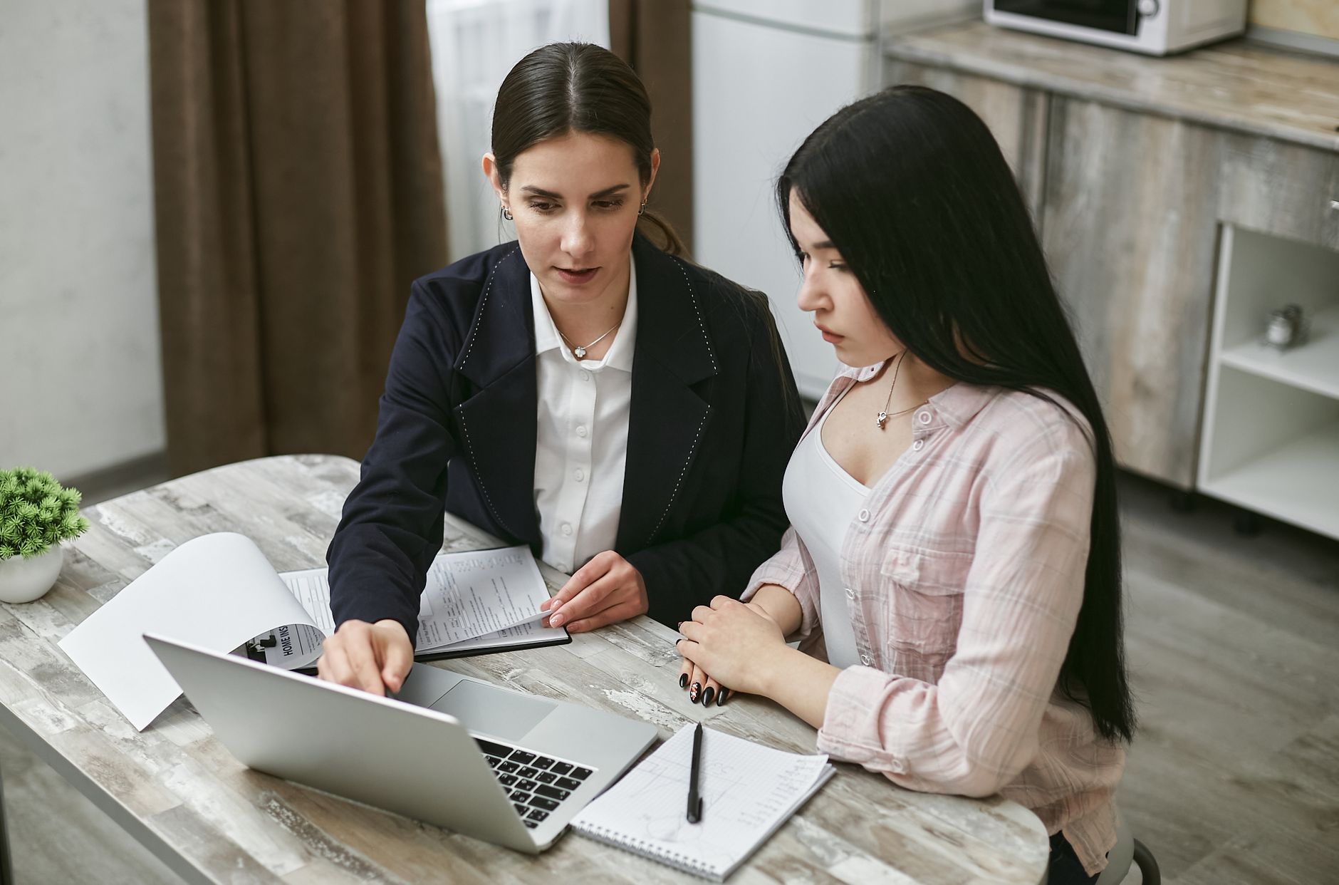 Web designer reviewing portfolio with small business client