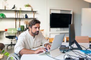 Developer working on accessible website design for small business on laptop