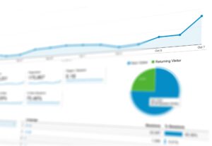 Small business owner tracking website leads and conversions on analytics dashboard