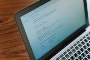 Website owner checking Google rankings and SEO analytics on laptop
