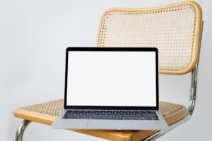 Designer reviewing modern web design trends 2026 on laptop with clean interface