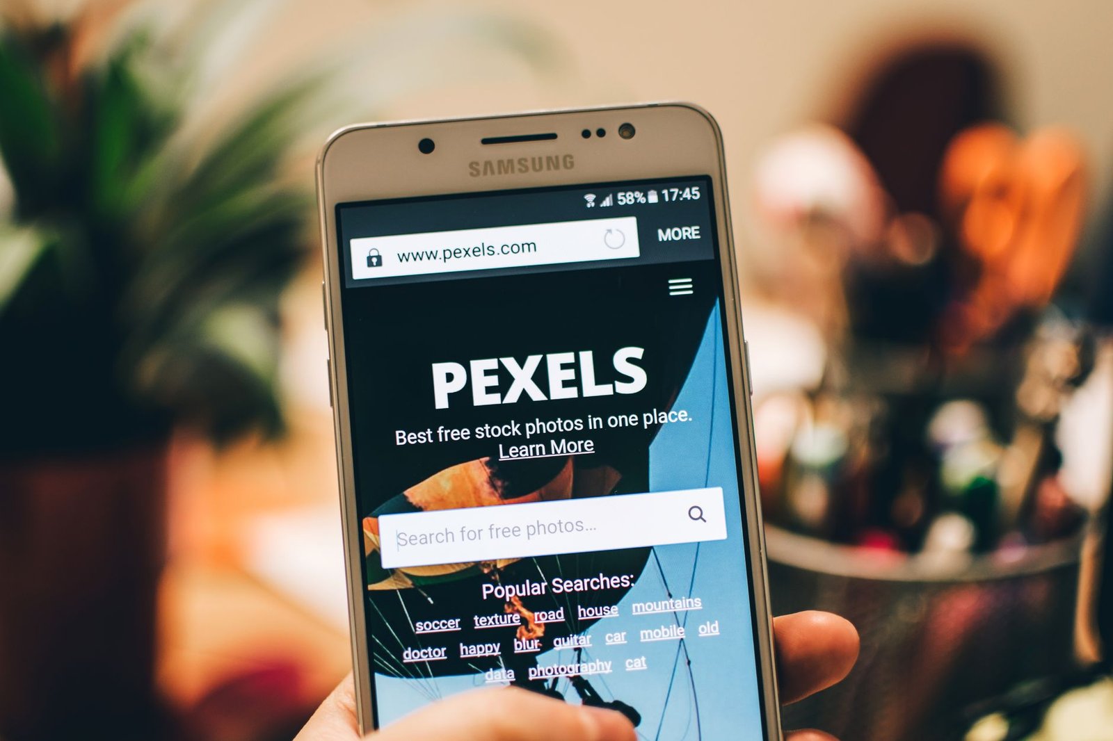 Small business website displayed on mobile phone showing responsive design